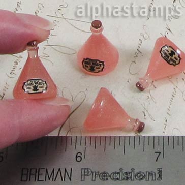 Pink Resin Flask with Frog Warts Label