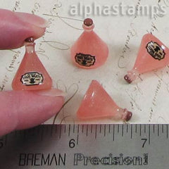 Pink Resin Flask with Frog Warts Label